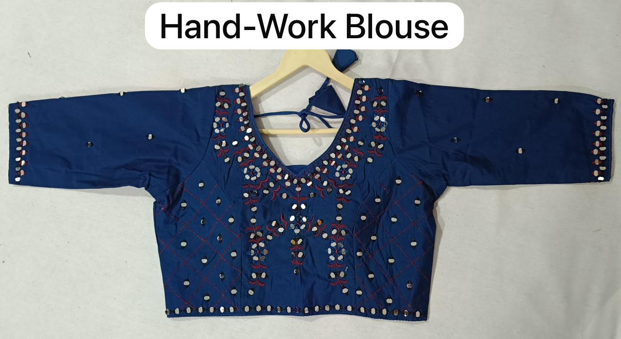 Blue blouse with intricate hand-work on a white background